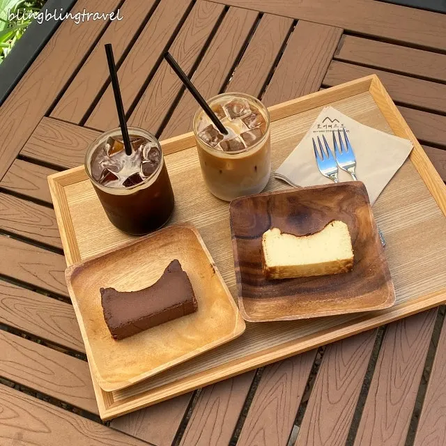 Two slices of original and chocolate Basque cheesecake