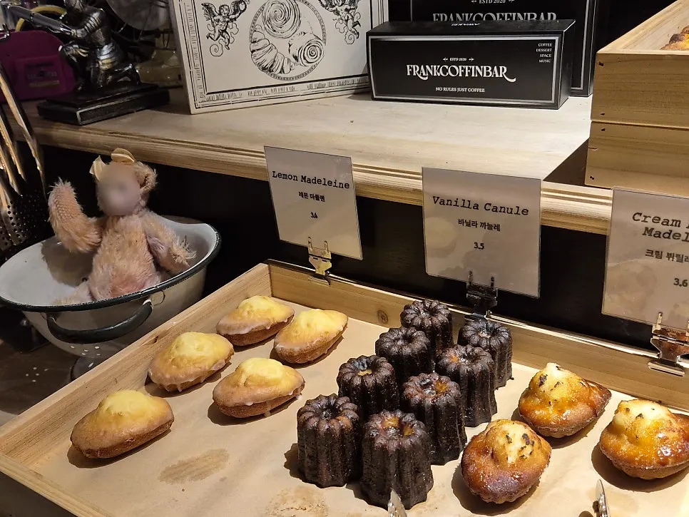 Bakery case with salt bread and financiers on display