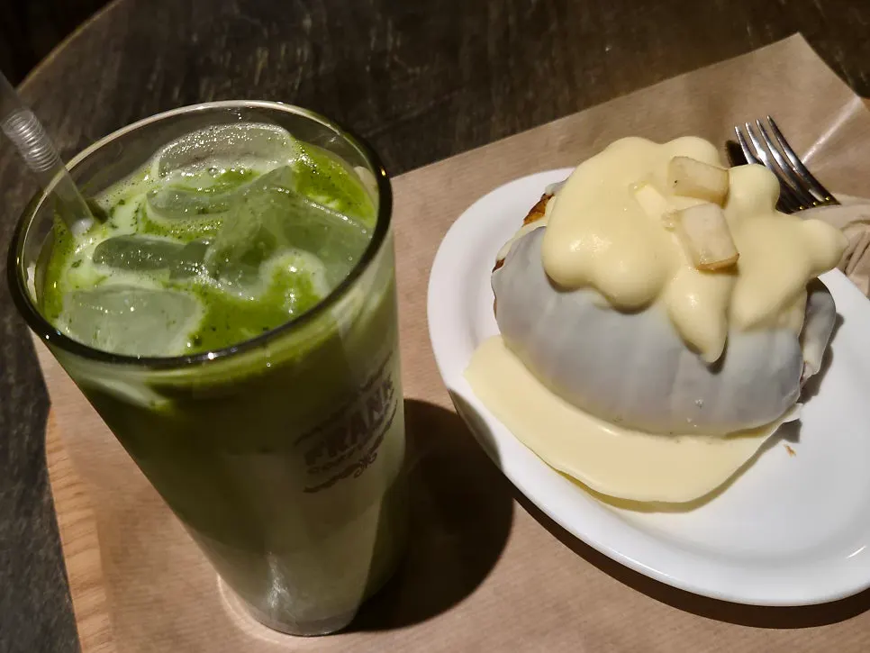 Matcha latte and peach salt bread together on the table