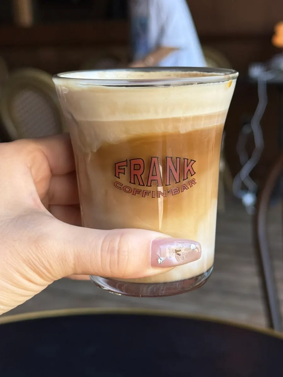 Close-up of Frank Coffee topped with cream
