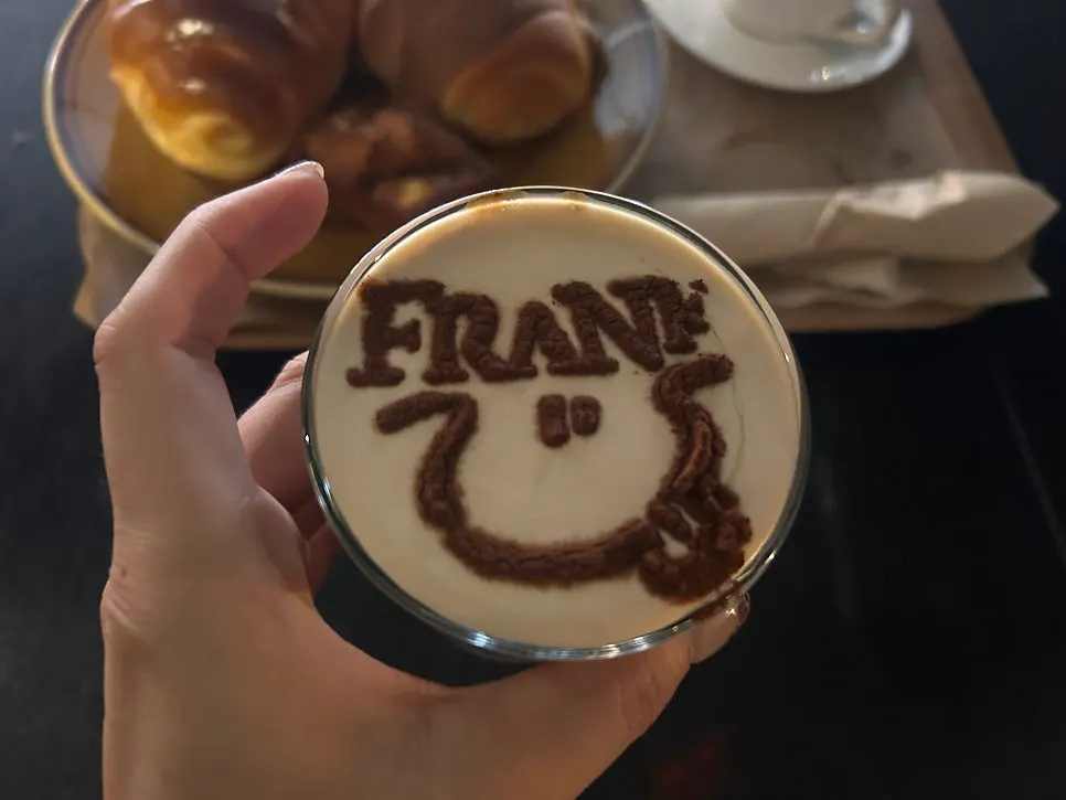 Frank Coffee cream latte with FRANK initials piped on top