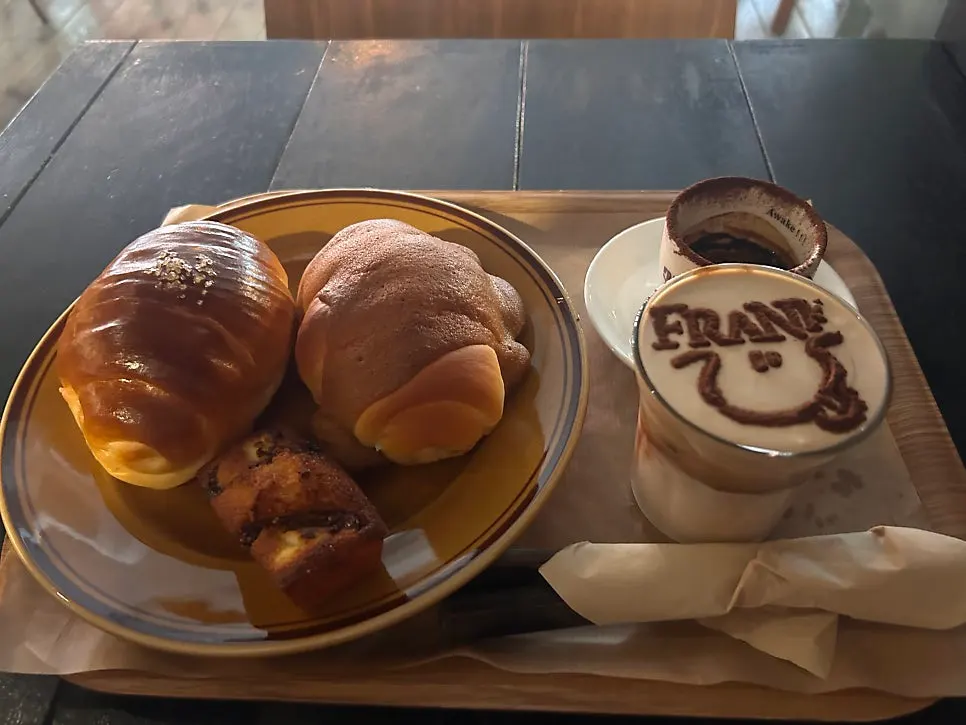 Salt bread and coffee arranged together on the table