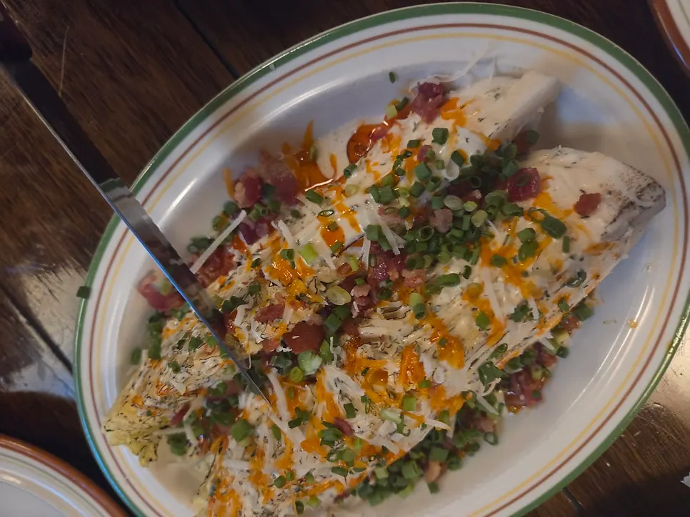 Cross-section of a Freewill pizza slice showing toppings