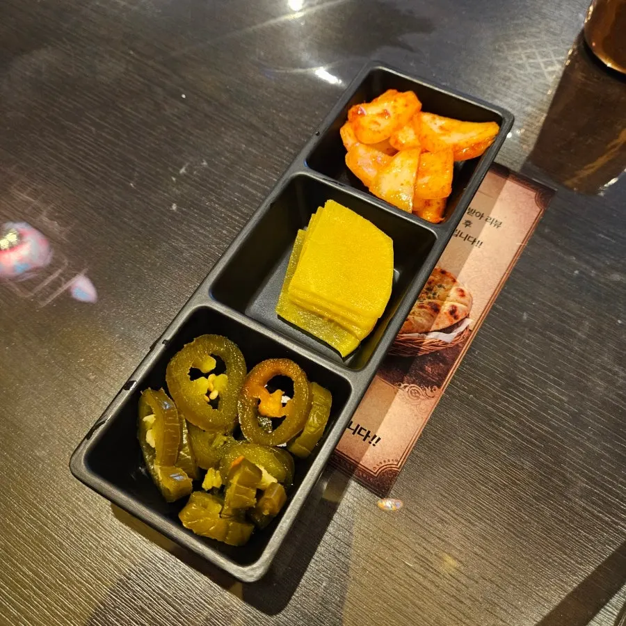 Kimchi and pickled radish served as side dishes