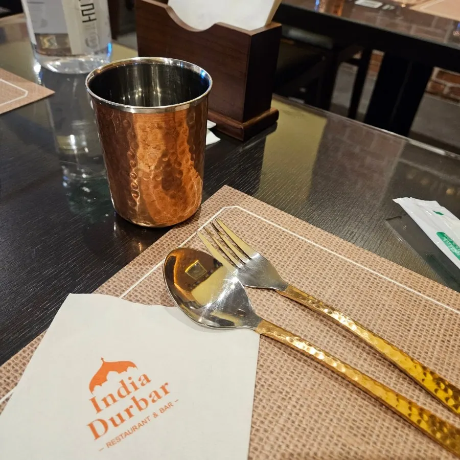 Tidy restaurant table with tableware arranged neatly
