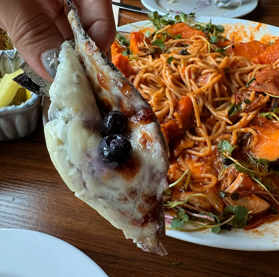 The whole arugula smoked salmon and blueberry half-and-half pizza