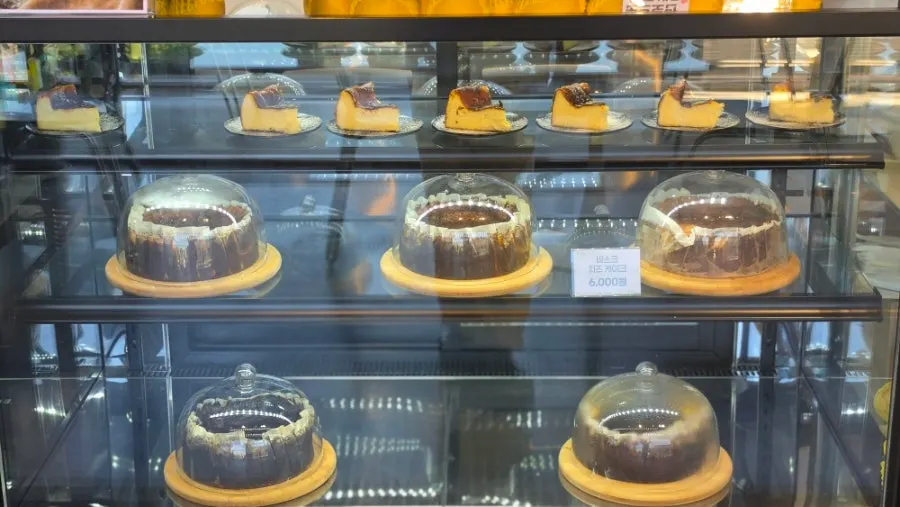 Dessert display case with Basque cheesecake