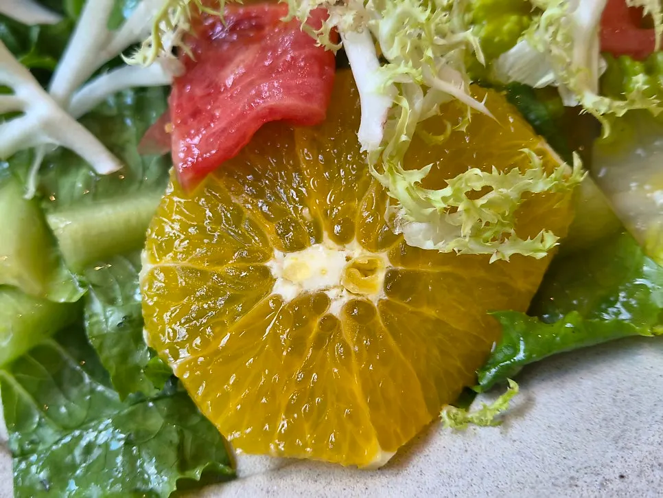 Close-up of a colorful leafy green salad