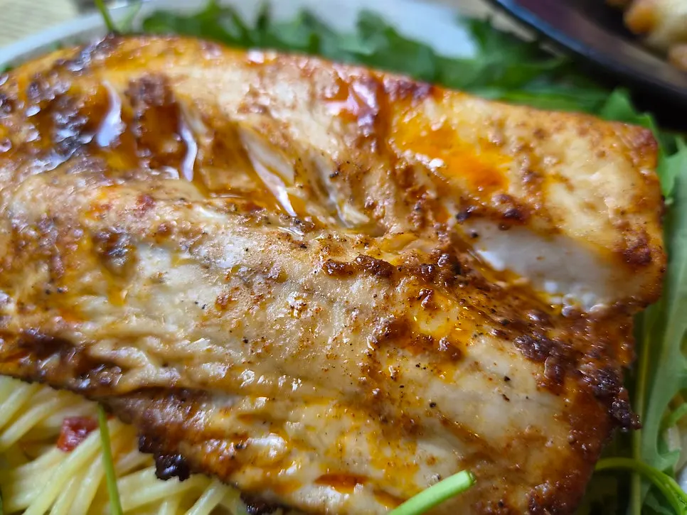 Close-up of mackerel pasta noodles and arugula