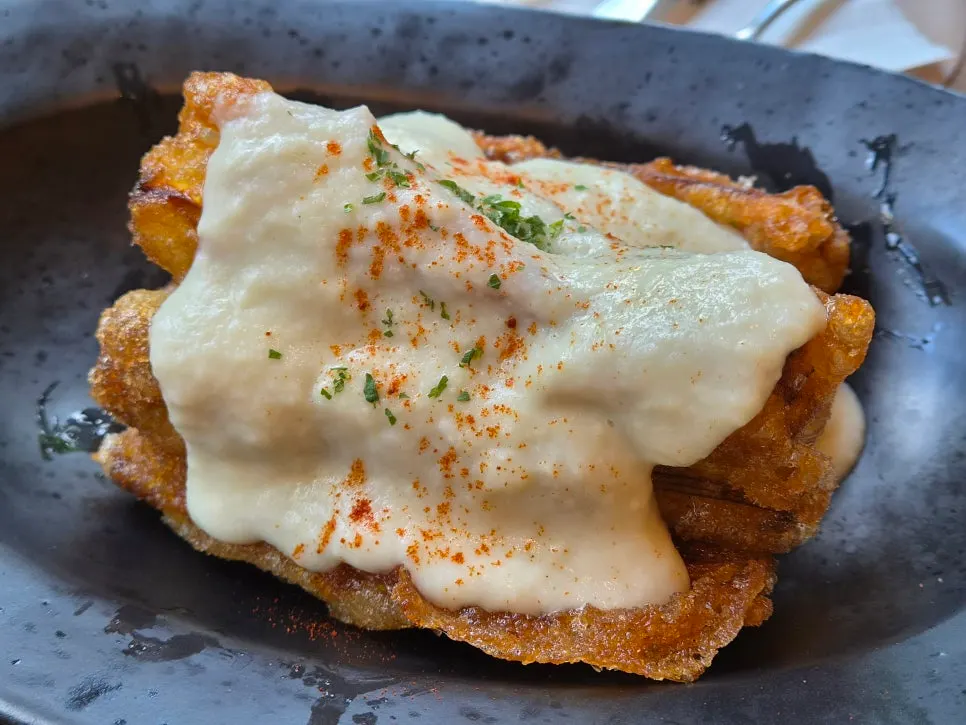 Crispy eggplant served with fish cream sauce