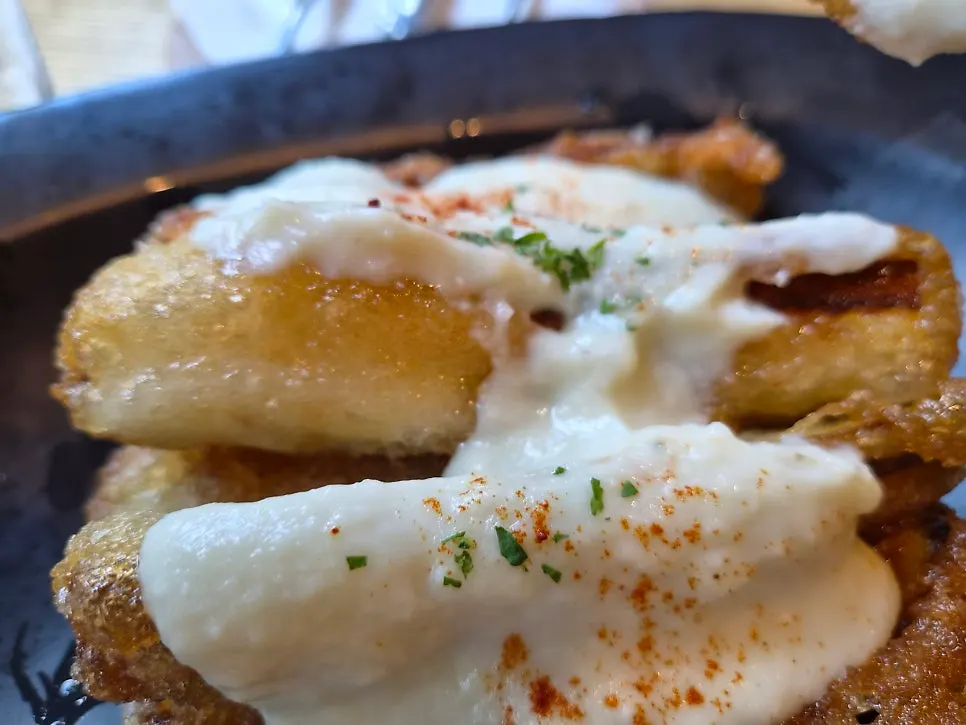 Close-up of eggplant dipped in sauce