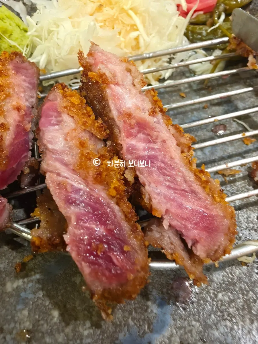 Cross-section of gyukatsu, crispy outside and moist inside