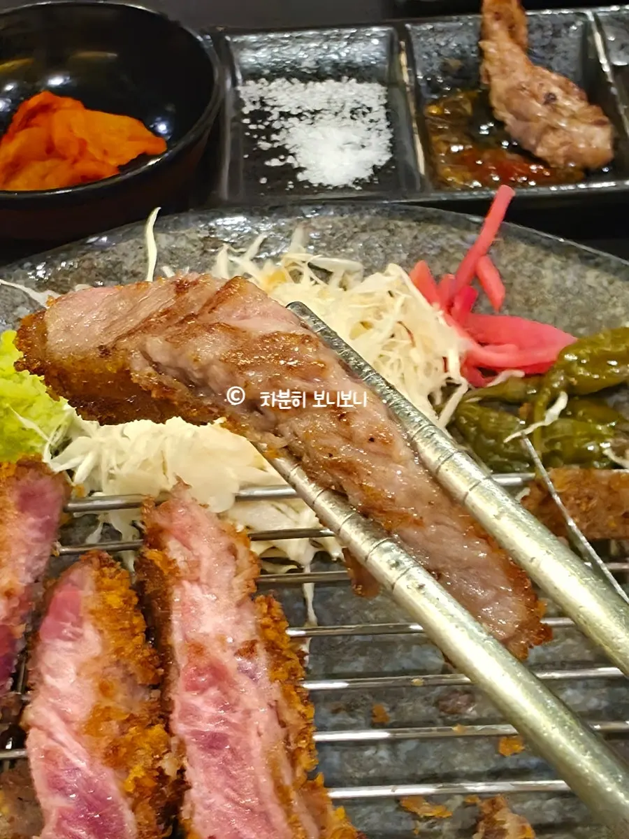 A grilled piece of gyukatsu from the brazier