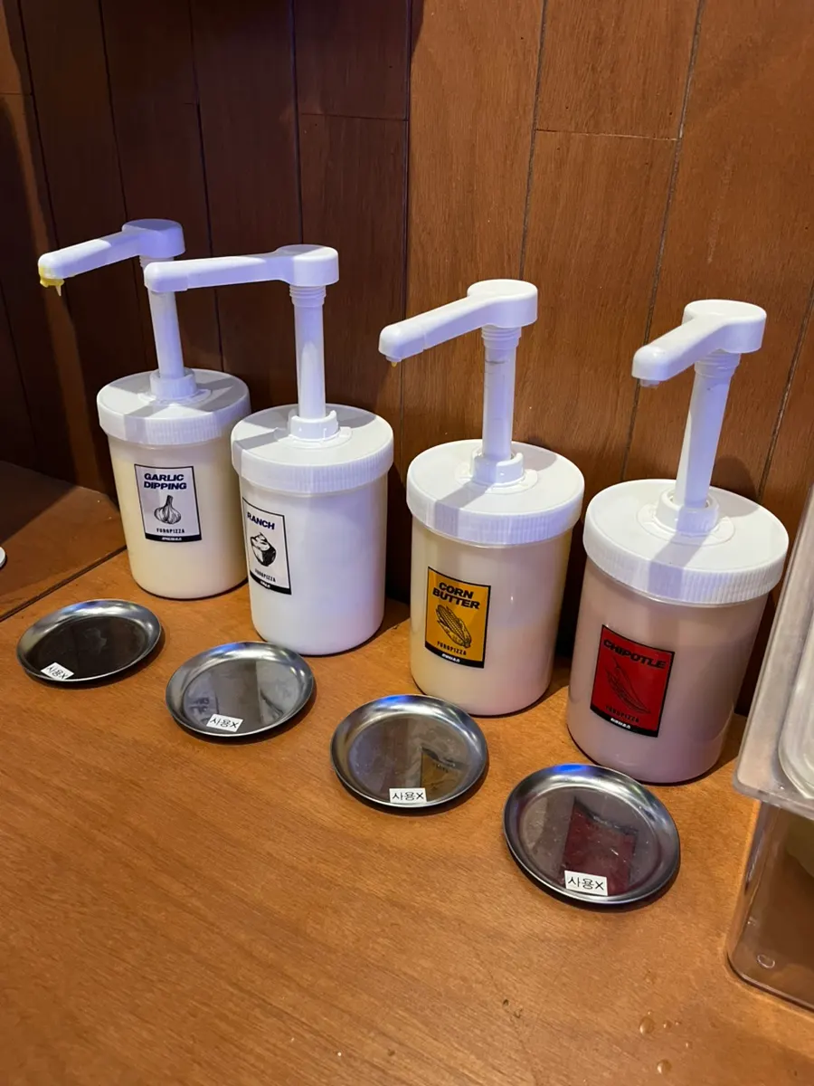 Self-serve zone with sauces and ice water