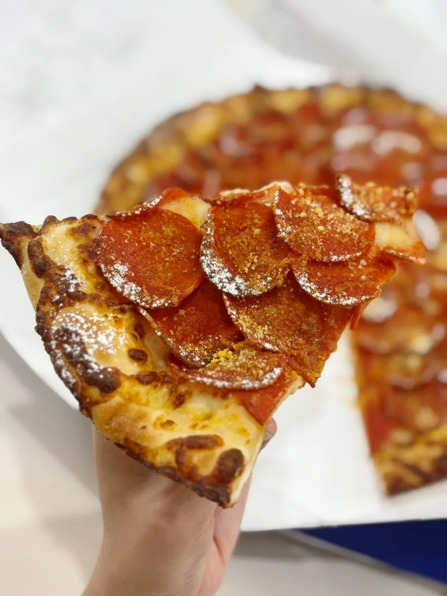Close-up of pepperoni piled like a hurricane