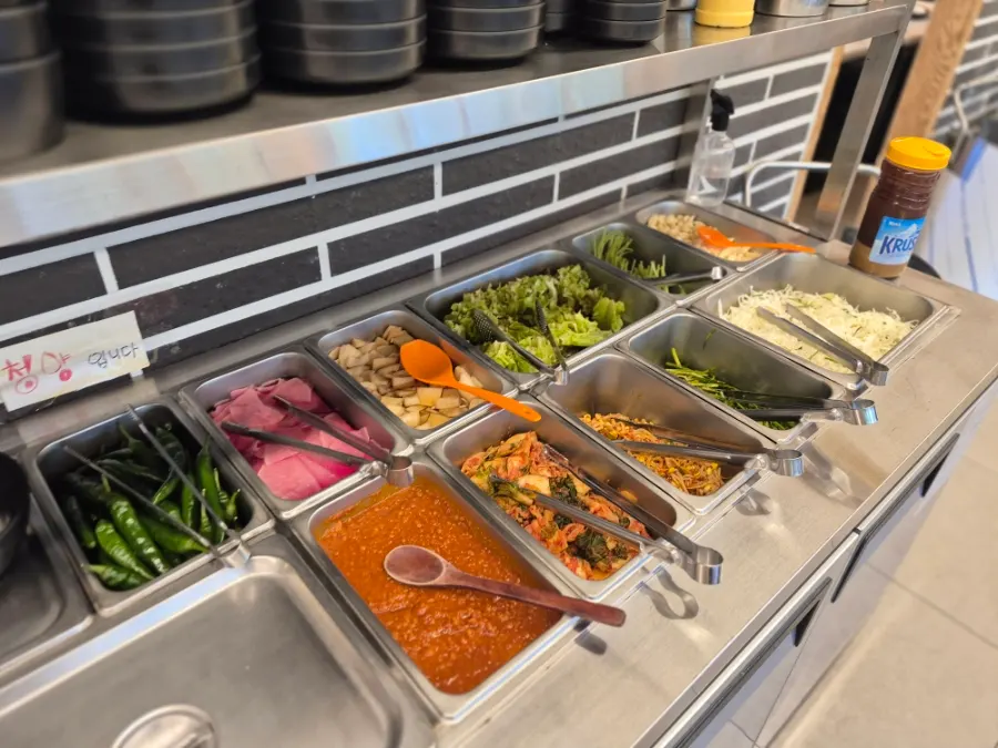 Lettuce wraps and side dishes brought from the self-serve bar