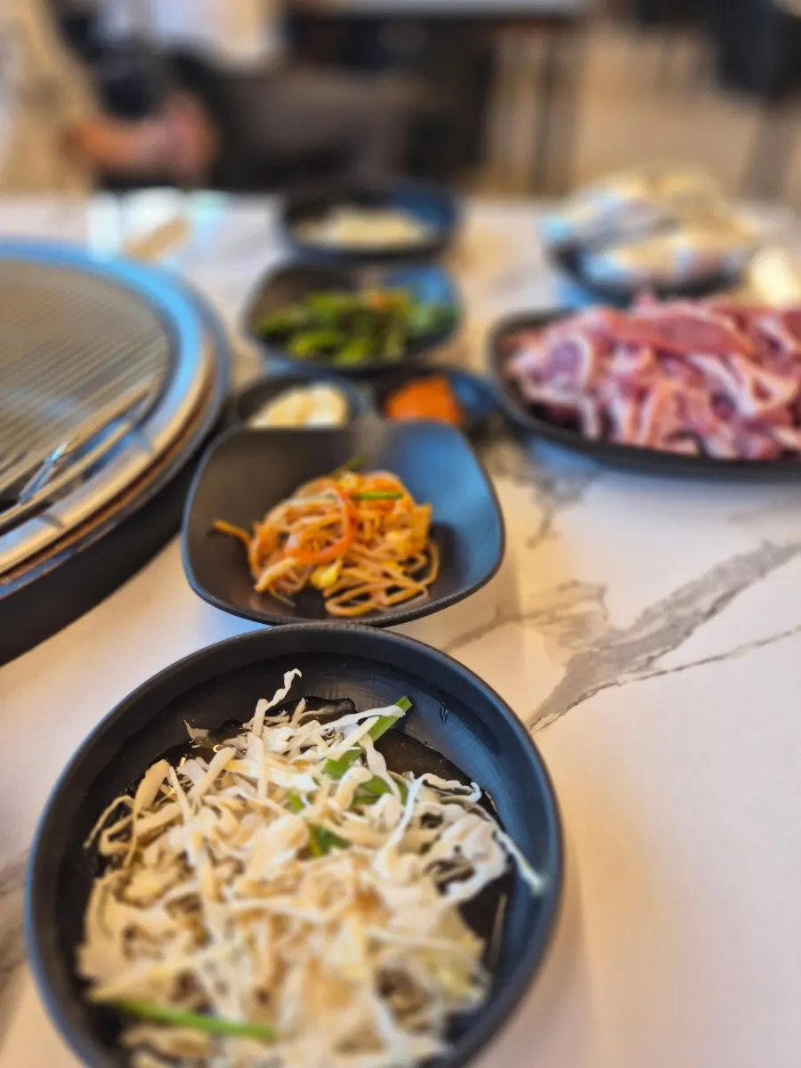 Close-up of raw duck meat arranged vertically on the plate