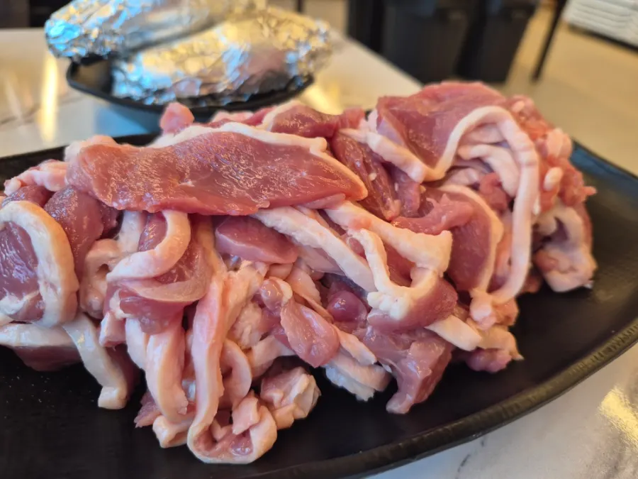 Raw duck and table setting before going on the grill