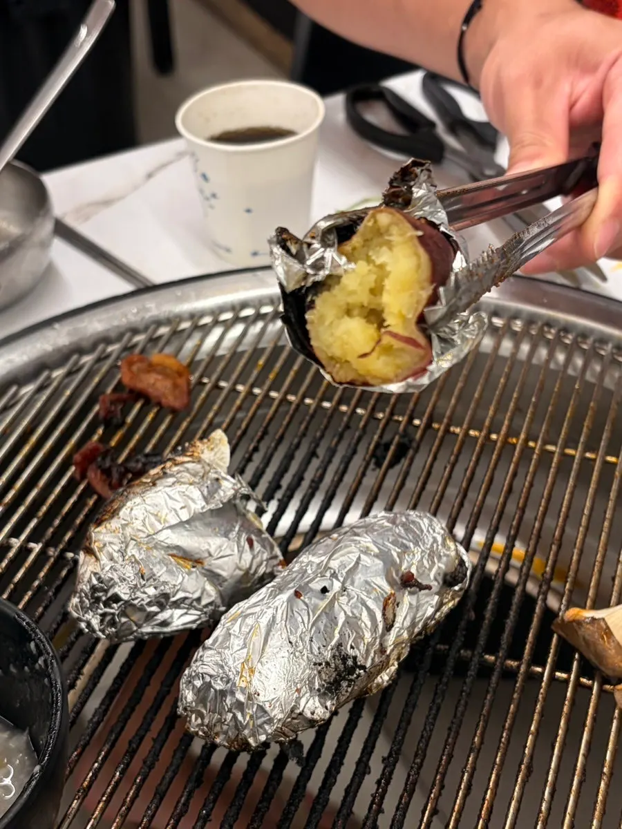 Mushrooms grilling together with the duck