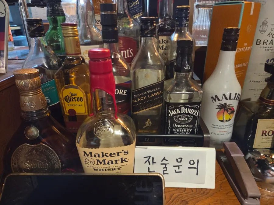 Whiskey bottles displayed at the Apgujeong Sinpocha counter