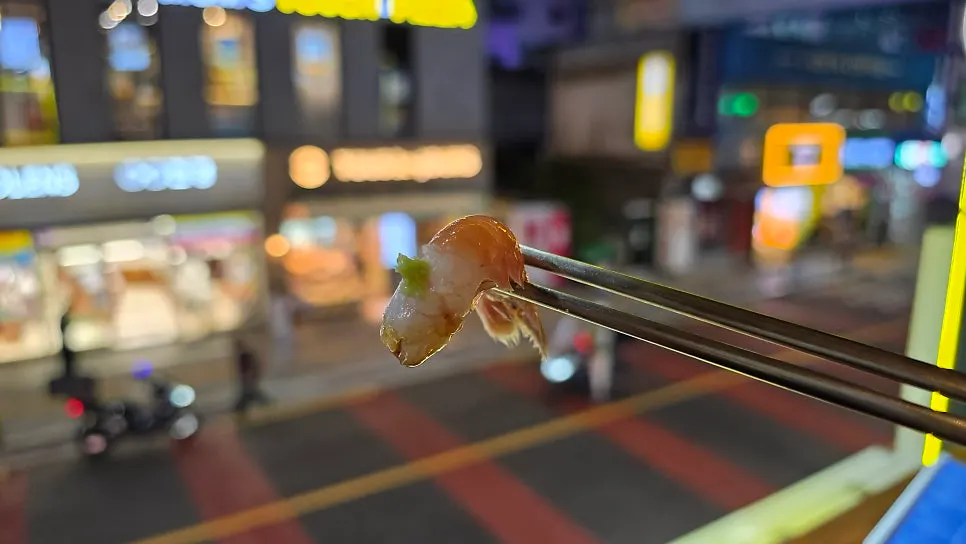 A piece of sweet shrimp sashimi with the meat removed from the shell