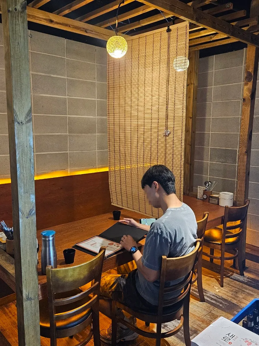 Partitioned seating inside the Korean pub