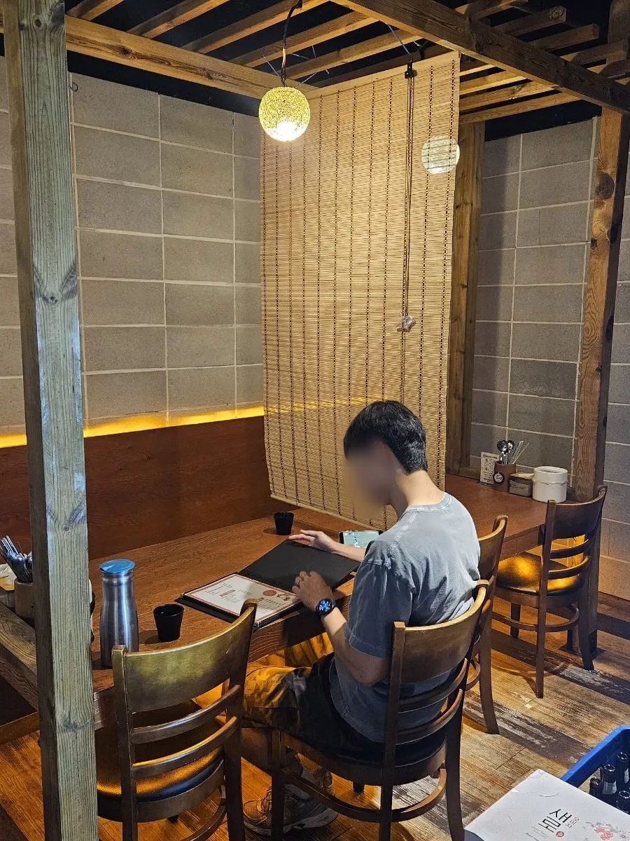 Partitioned seating inside the Korean pub