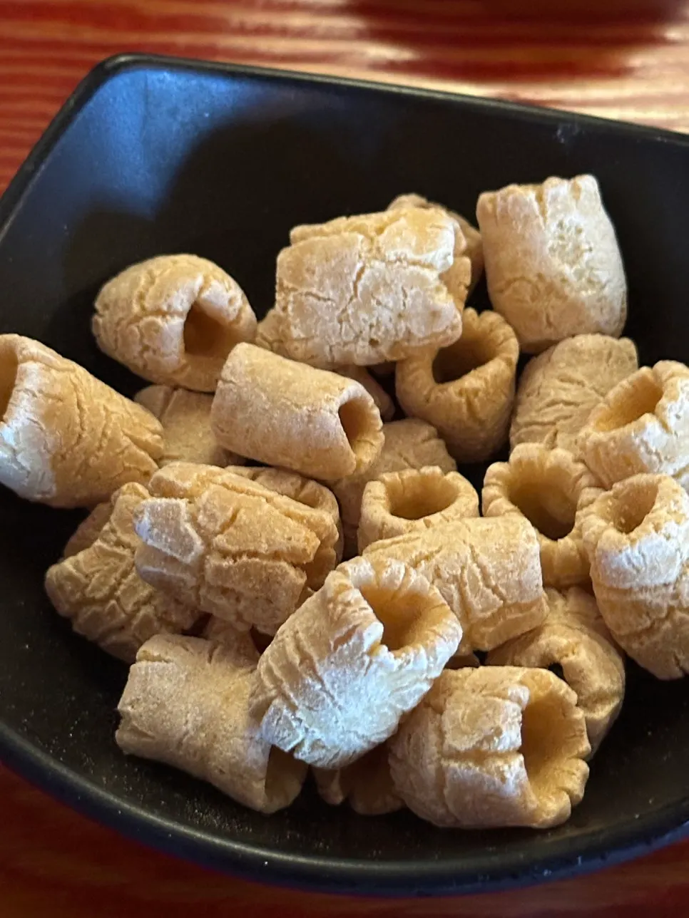 A bowl full of basic cracker side dishes