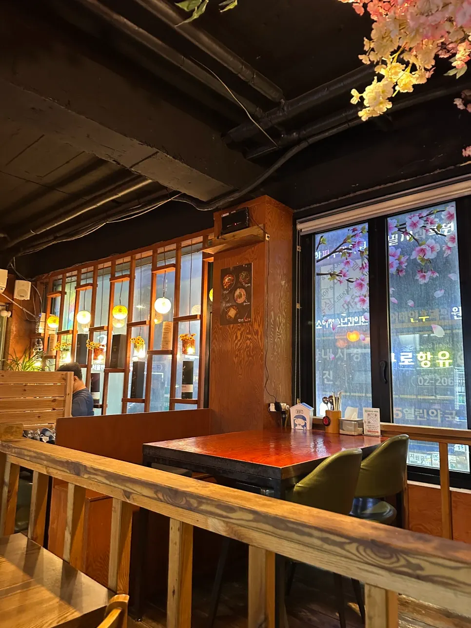 A pocha table set with fire-grilled dishes and drinks