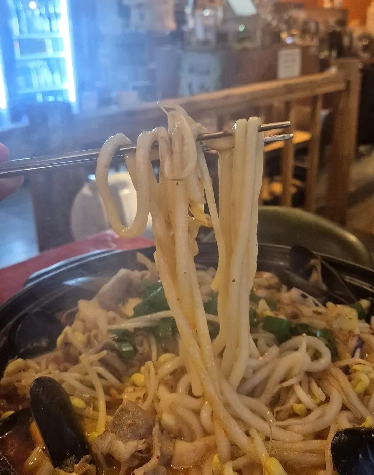 Broth of spicy jjamppong tang with jjamppong noodles included