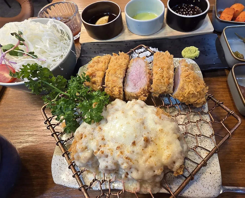 A tonkatsu spread with several dishes for sharing