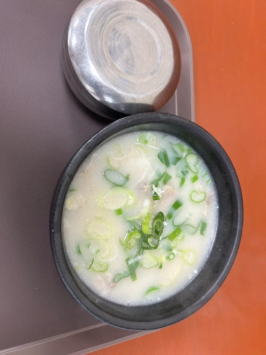 A full table setting of Gaeryeong Gukbap's pork soup