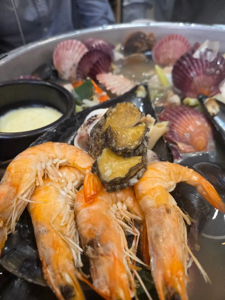 Cheese stretching from the seafood fondue