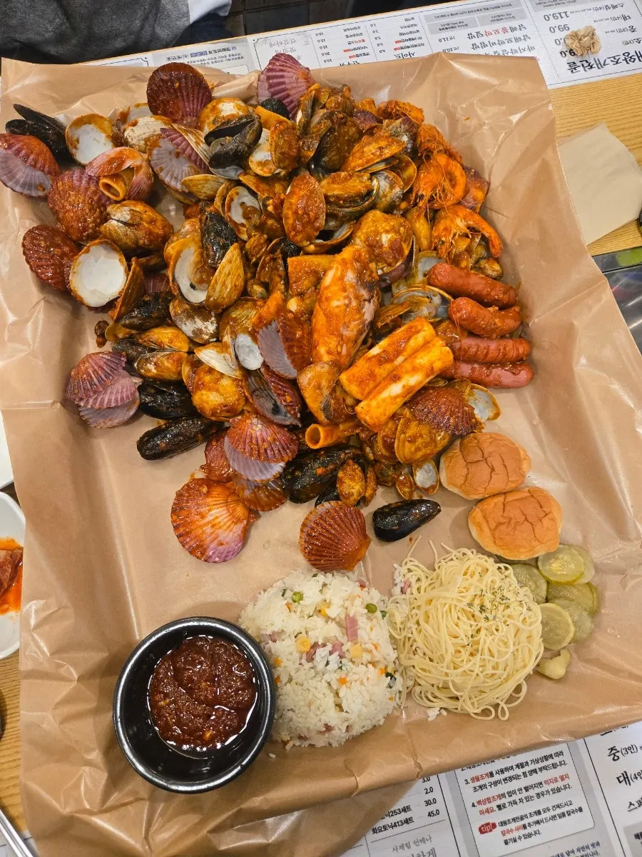 Seafood boil for two piled high on a tray