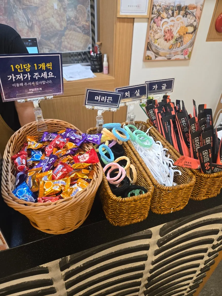 Checkout counter with hair ties, floss, mouthwash, and candy
