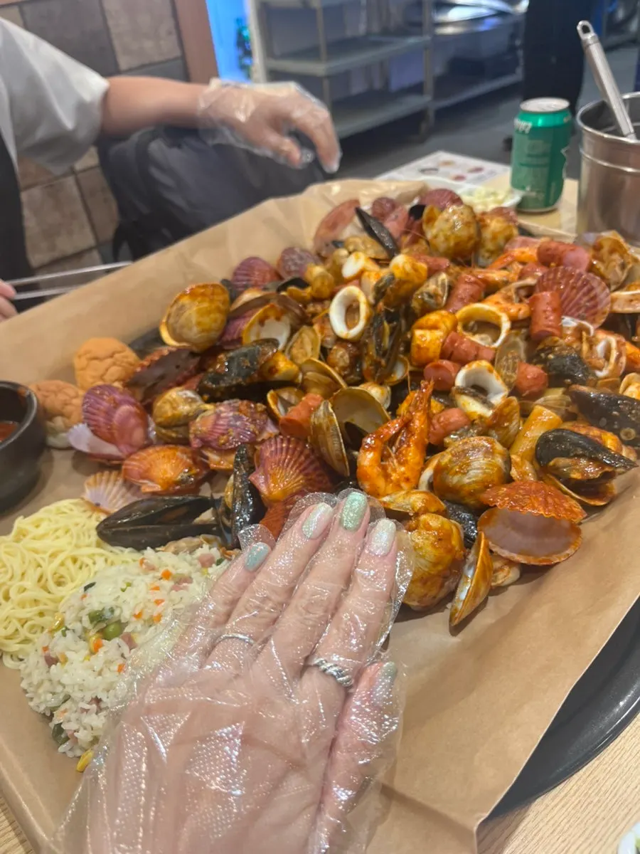 Rice and spaghetti noodles served alongside the seafood boiling