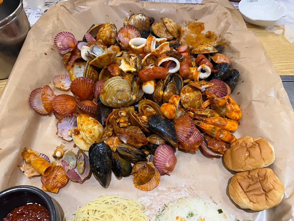 Seafood boiling with abalone and whole squid