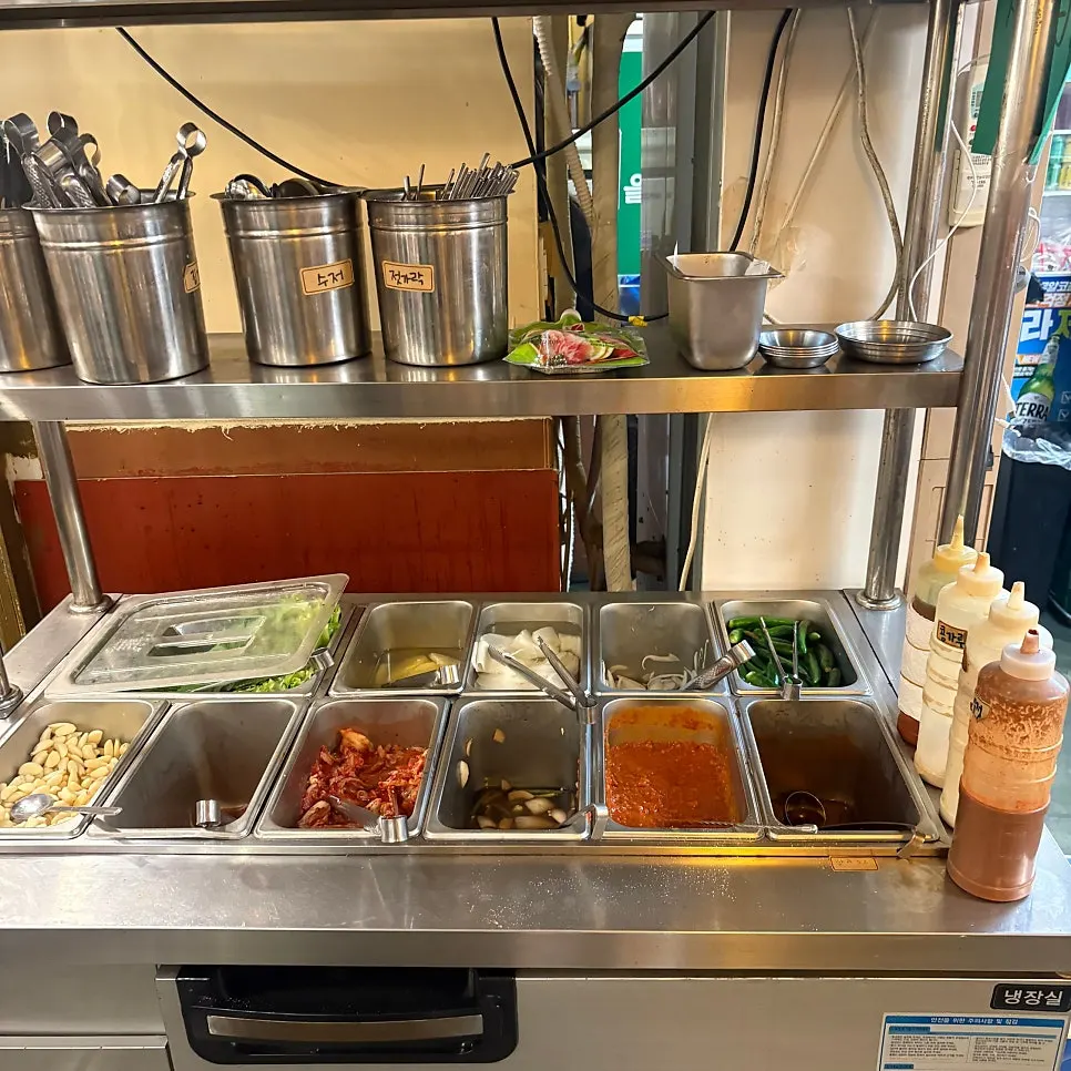 Self-service bar stocked with meat sides