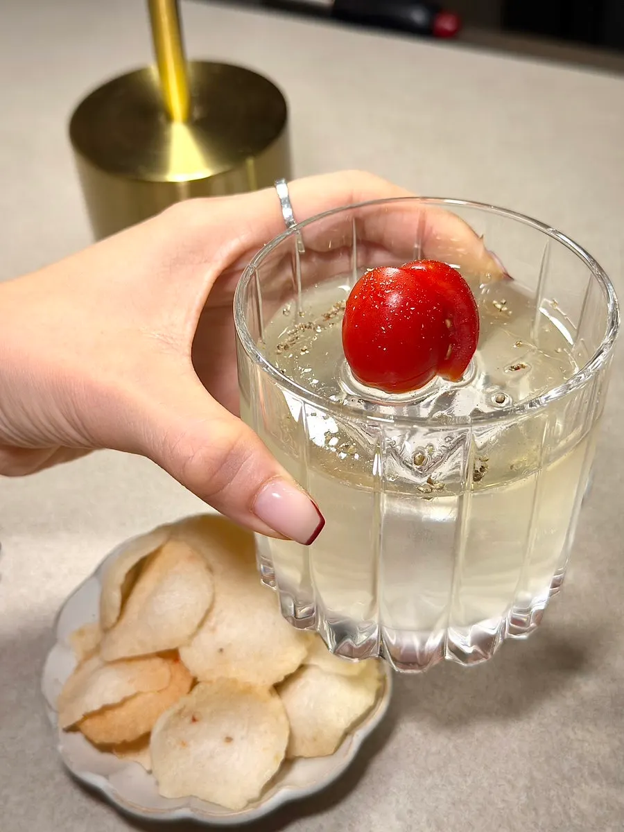 A cocktail made with tomato and basil