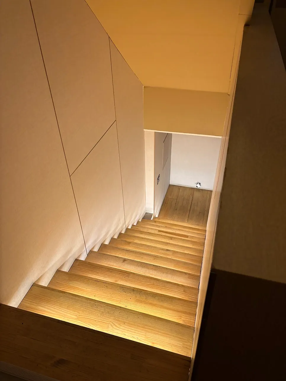 Wood-interior passage leading down to the basement level of Gak Seoul