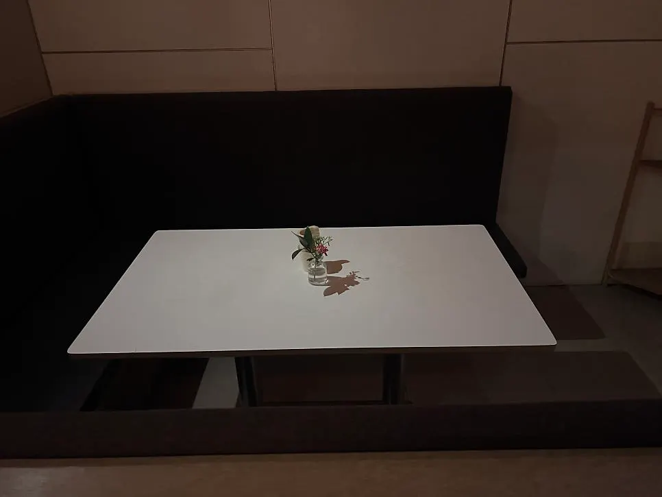 Table area with plush sofas at Gak Seoul