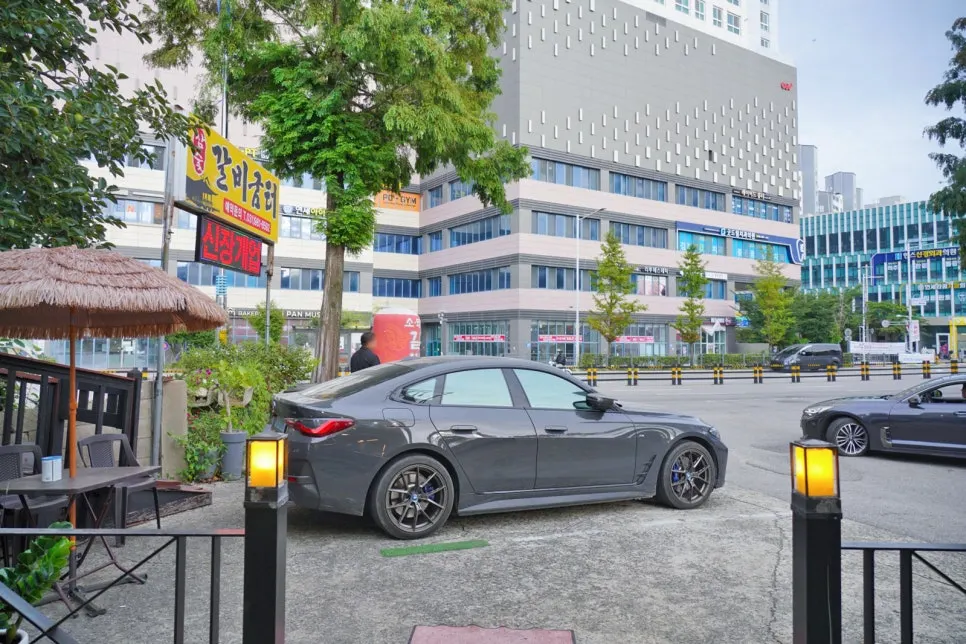 The larger parking lot behind the building