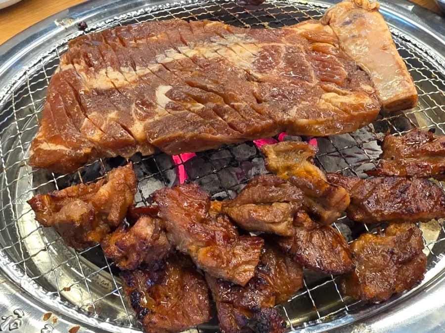 Two servings of domestic handmade king pork ribs, 300g each, set on the table