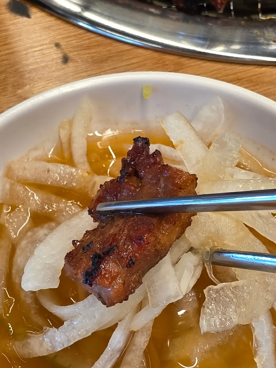Pork rib piece dipped in onion sauce