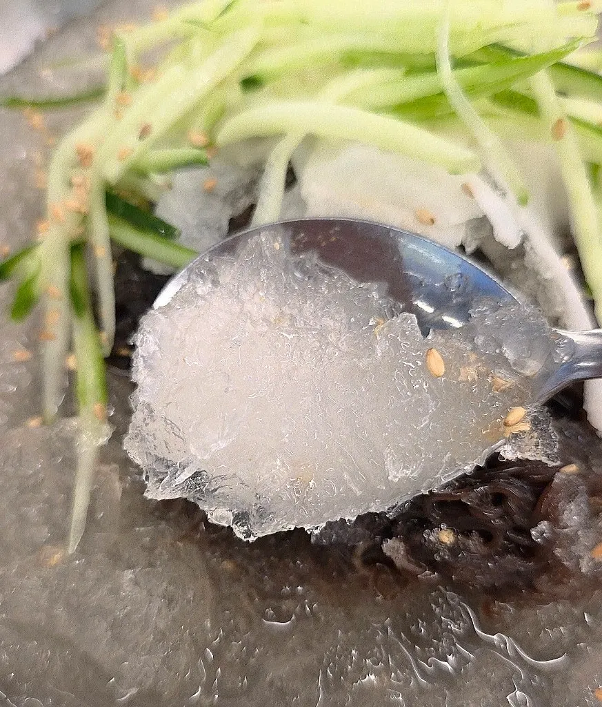 Chopsticks lifting springy mul-naengmyeon noodles