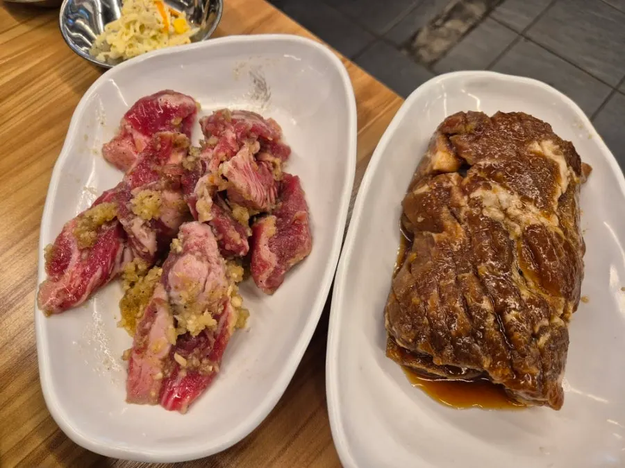 Garlic-marinated beef ribs and pork king ribs on the charcoal grill