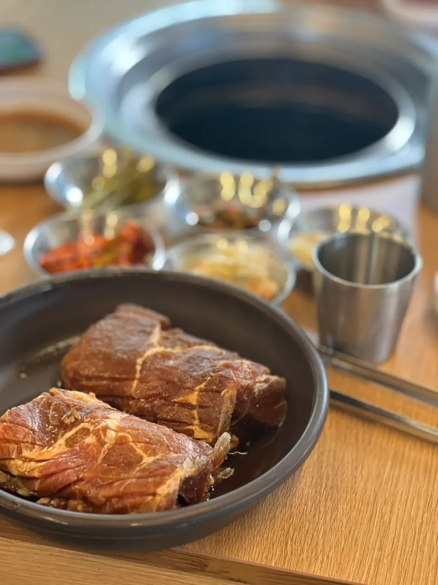 Scored handmade king pork ribs plated for grilling