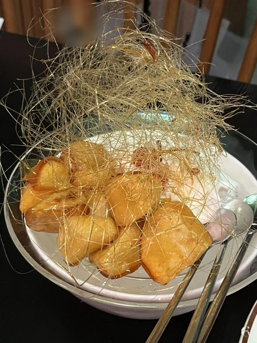 Ice cream basi with candied sweet potato served over yogurt ice cream