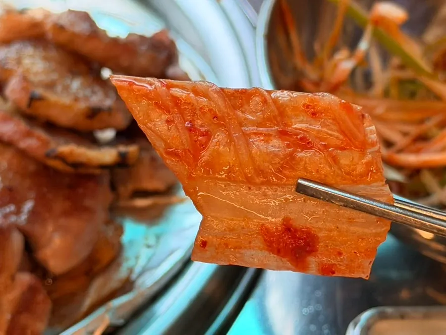 Grilled pork belly served with kimchi