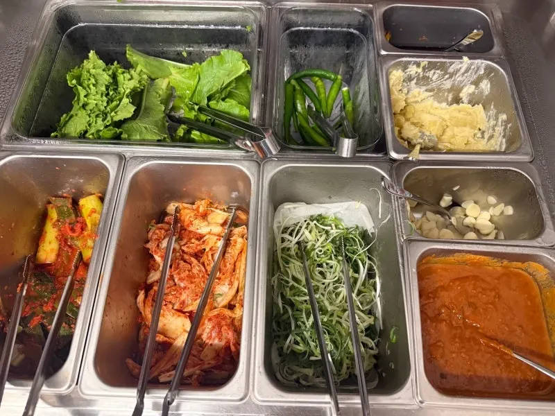 Self-serve bar with wrap vegetables and sauces
